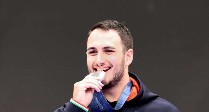 epa11501581 Silver medalist Federico Nilo Maldini of Italy poses during the medal ceremony for the 10m Air Pistol Men event of the Shooting competitions in the Paris 2024 Olympic Games at the Shooting centre in Chateauroux, France, 28 July 2024.  EPA/VASSIL DONEV